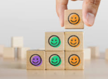 Emojis representing different moods on building blocks. 